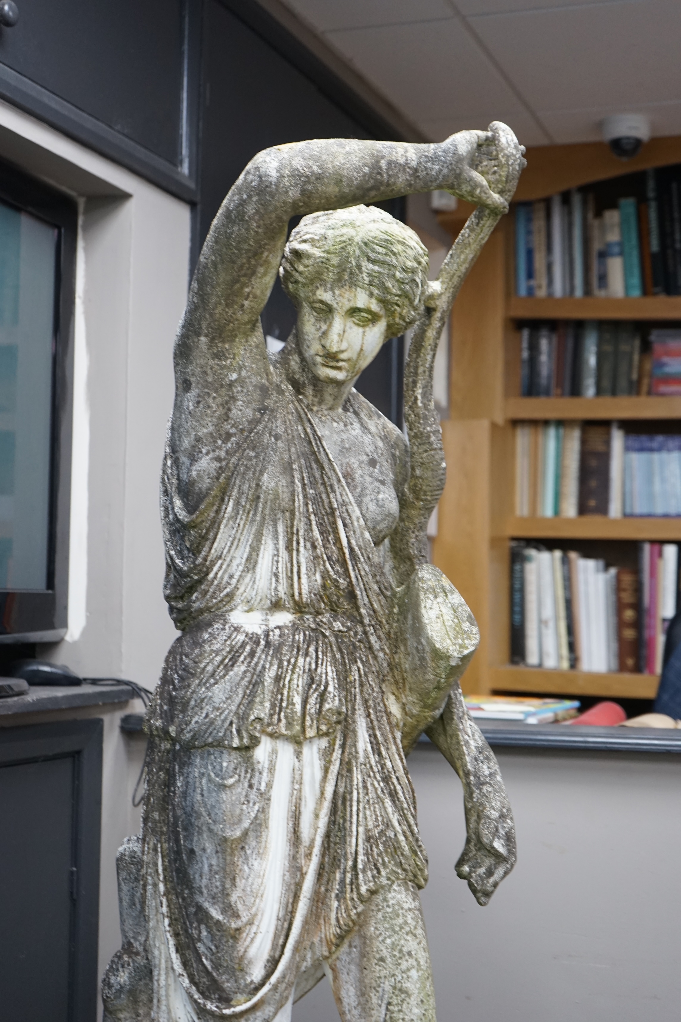 An Italian composition marble statue of Diana the Huntress, on a square reconstituted stone plinth